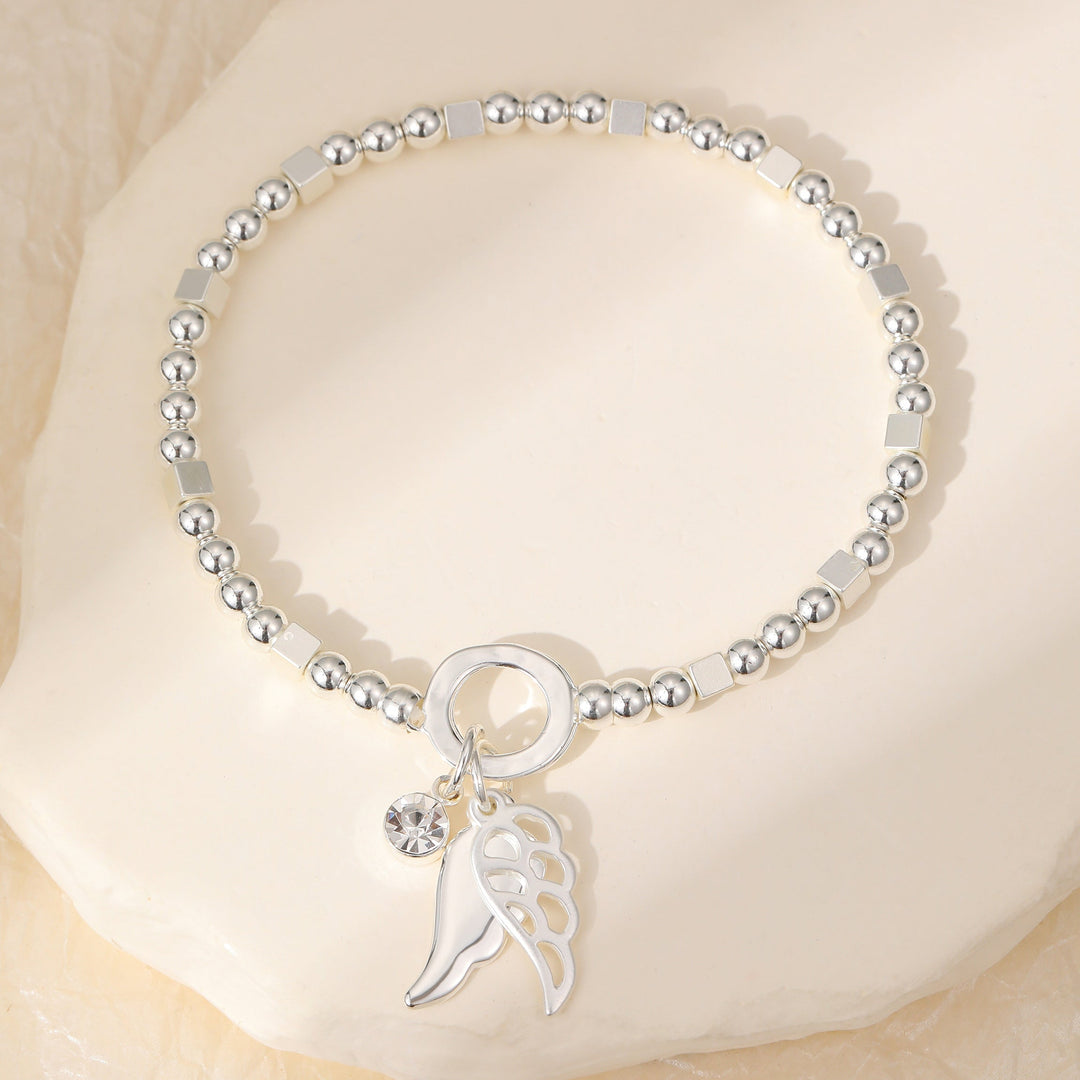Angel Wing Silver Beaded Stretch Bracelet - Sugarplum Boutique