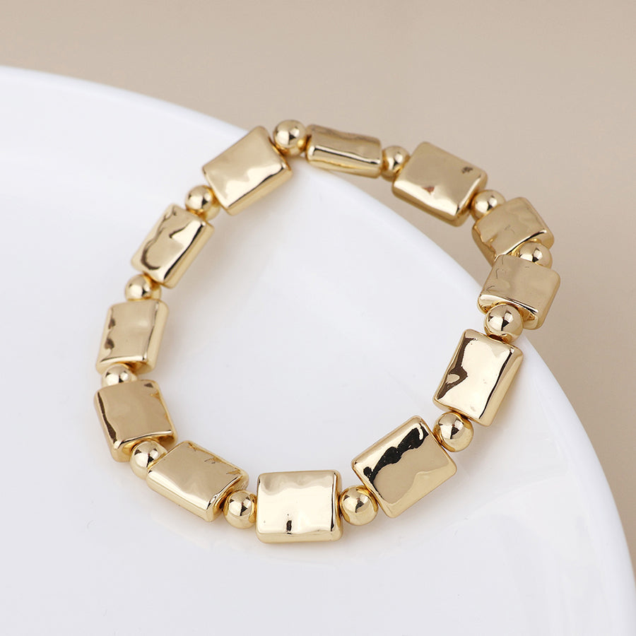 POM Cassia Golden Polished Bead Oblong Stretch Bracelet - Sugarplum Boutique