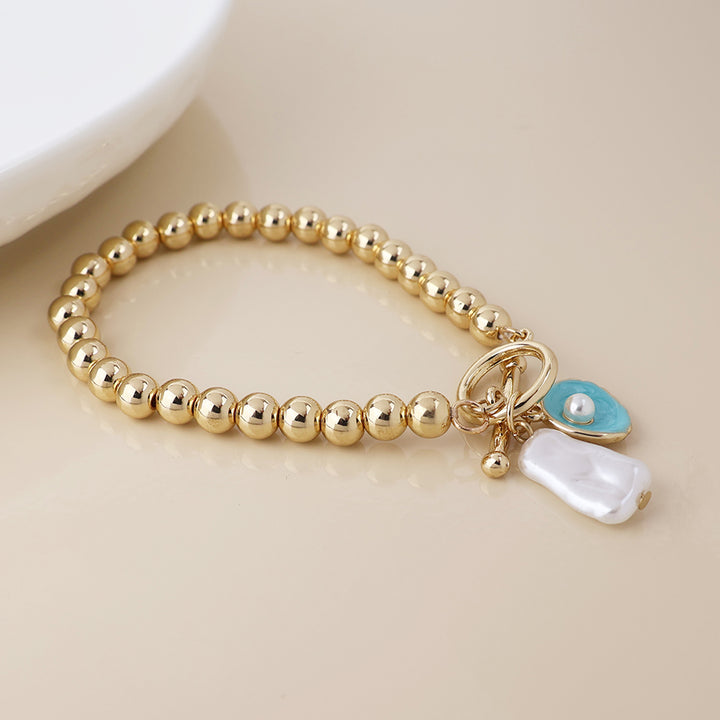 POM Golden T-Bar Shell Pearl Charm Bracelet - Sugarplum Boutique