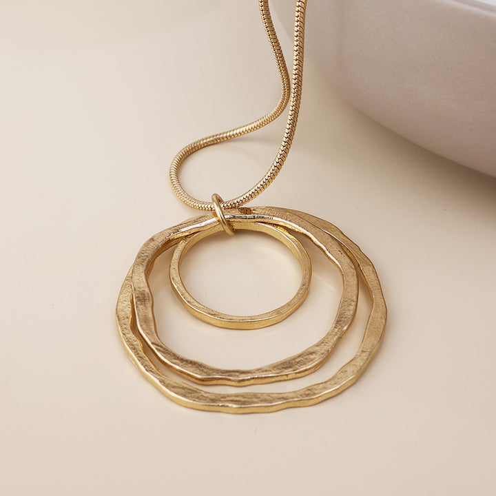 POM Luna Golden Worn Triple Beaten Ring Long Necklace - Sugarplum Boutique