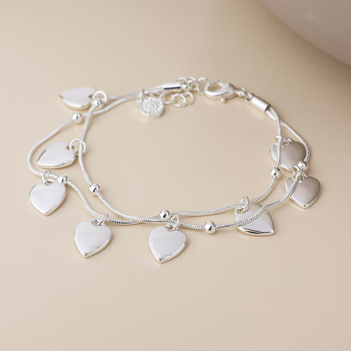POM Moonbeam Silver Plated Double Strand Heart Drops Bracelet - Sugarplum Boutique