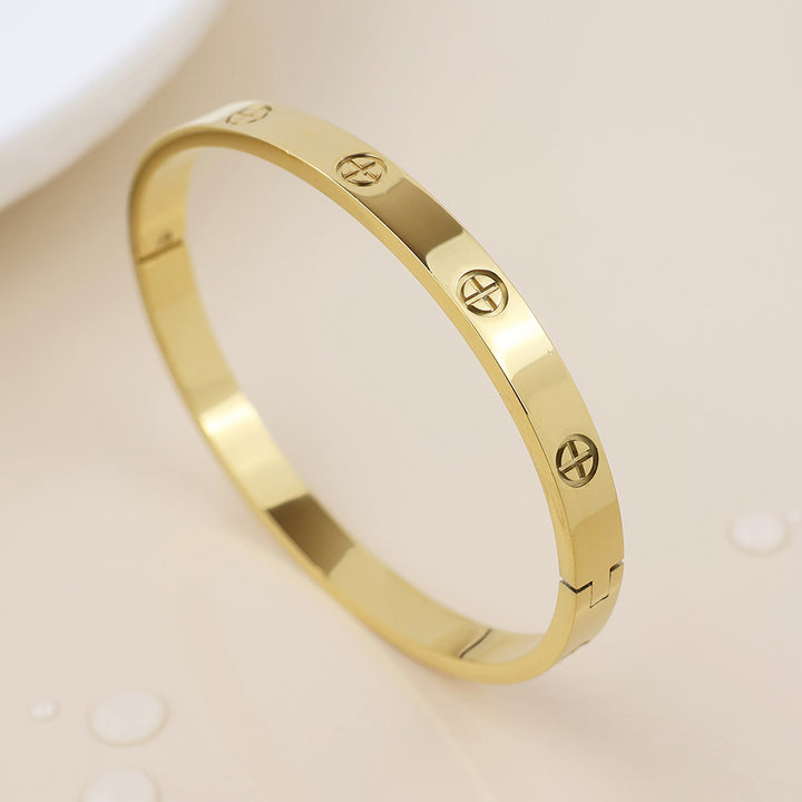 POM Waterproof Gold Plated Embossed Sun Cross Bangle - Sugarplum Boutique