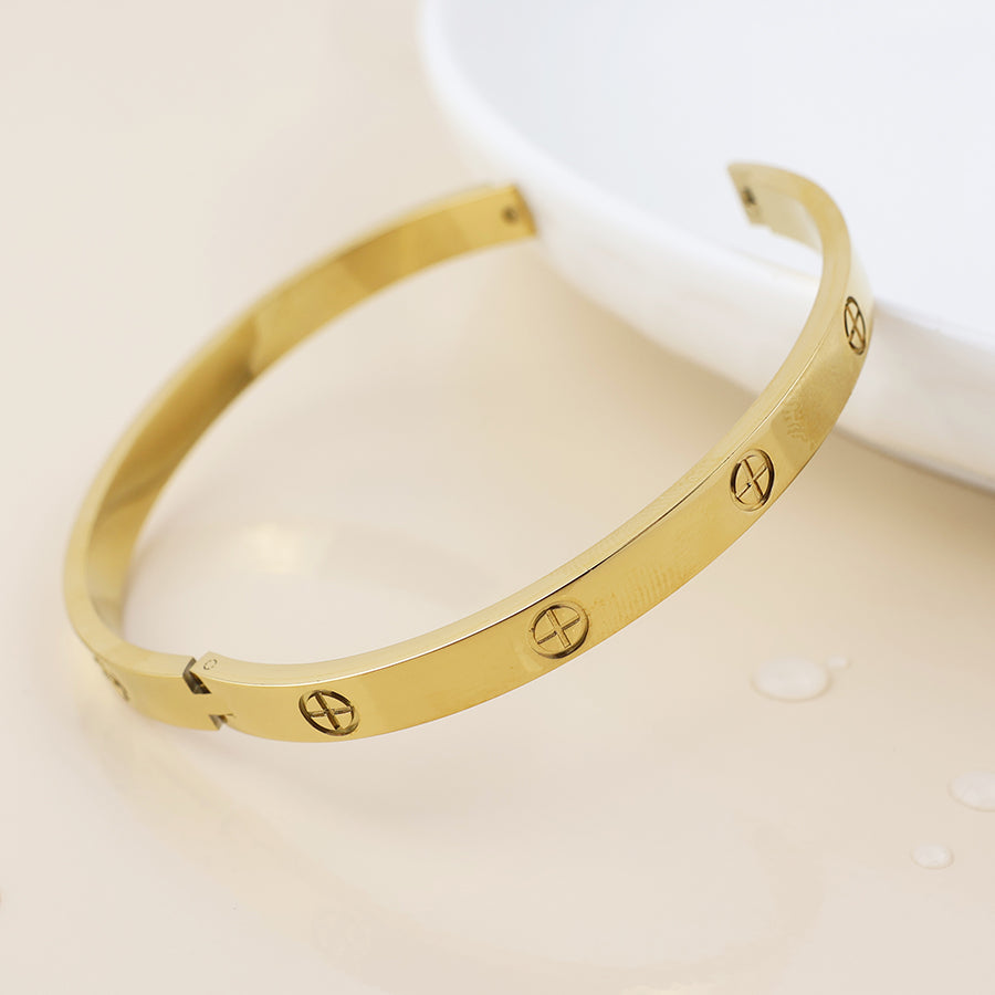POM Waterproof Gold Plated Embossed Sun Cross Bangle - Sugarplum Boutique