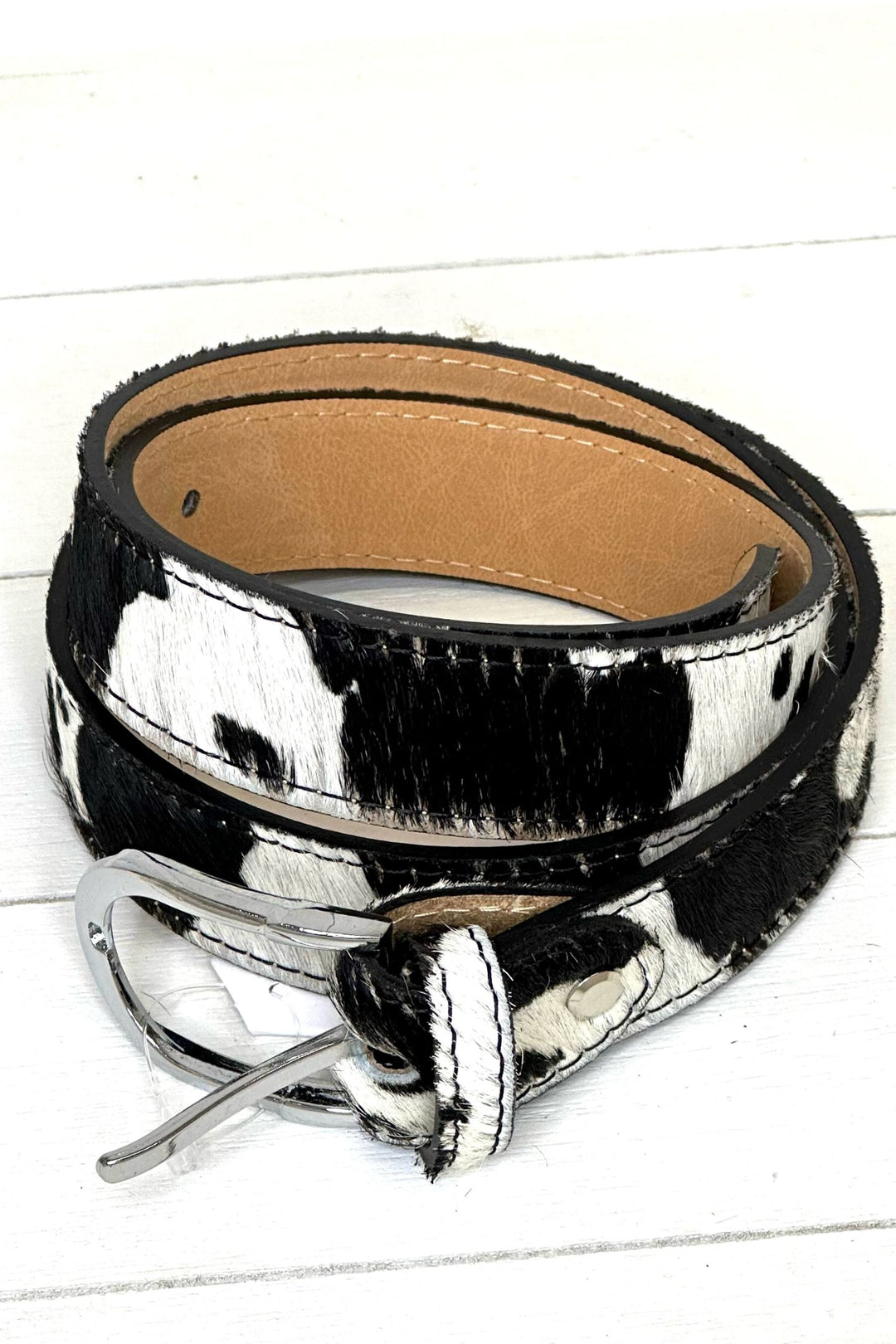 https://www.sugarplumonline.co.uk/cdn/shop/products/Vera-Pelle-Animal-Print-Leather-Belts-Cow-Black-_-White_1.jpg?v=1666170657&width=1080
